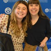 two women smile for picture